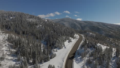 Aerial-Orbiting-shot-of-a-mountain-road-outside-of-steamboat-Springs