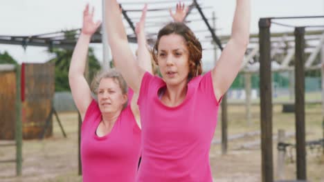 female friends enjoying exercising at boot camp together