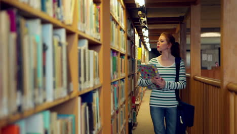 student walking through the library