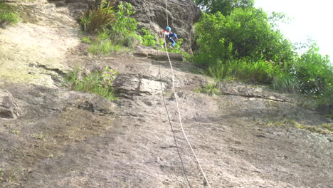 a child descending rapidly in mid air over a cliff