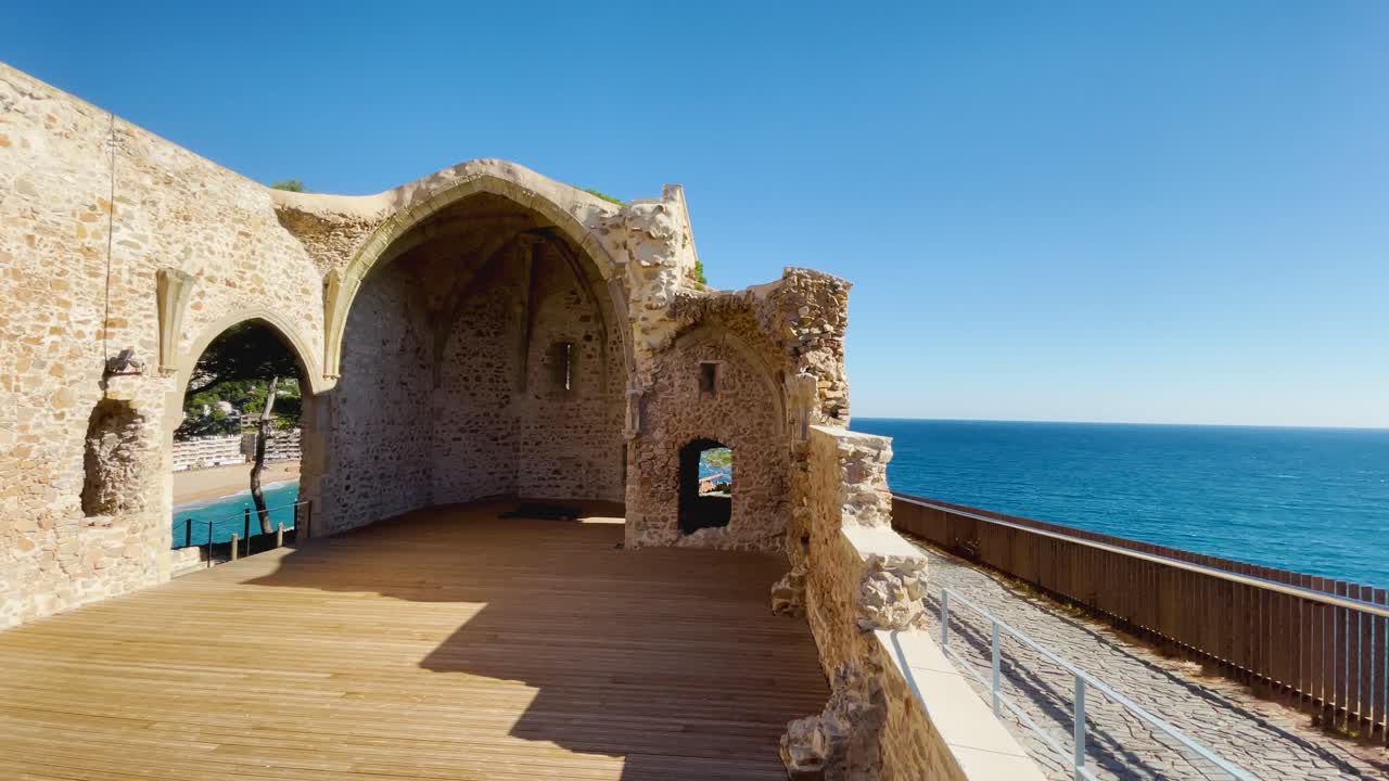 Ruins of an old church in Tossa de Mar medieval style Spain Europe background turquoise blue Mediterranean sea