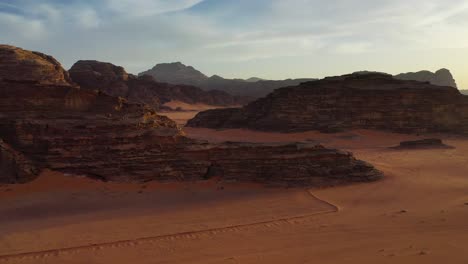 Wadi-Rum-rocks-and-shadows-at-sunset,-Valley-of-the-Moon-in-Jordan,-aerial-view