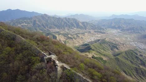 adventure tourists hike remote wild section of great wall of china