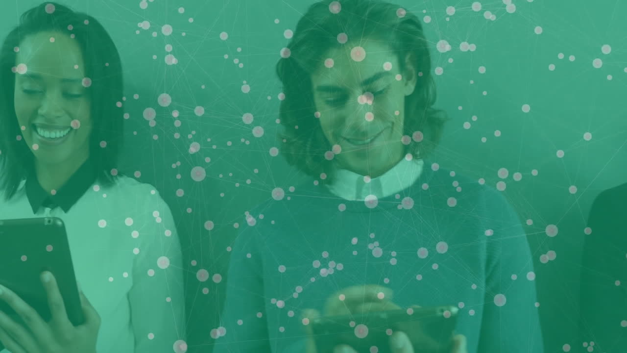 Three colleagues sharing content on smartphones in tech studio, displaying floating network overlay