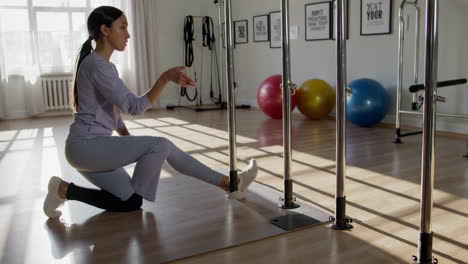 woman stretching in a fitness studio