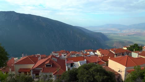 Ancient City of Delphi and Modern Red Tile Rooftop Houses