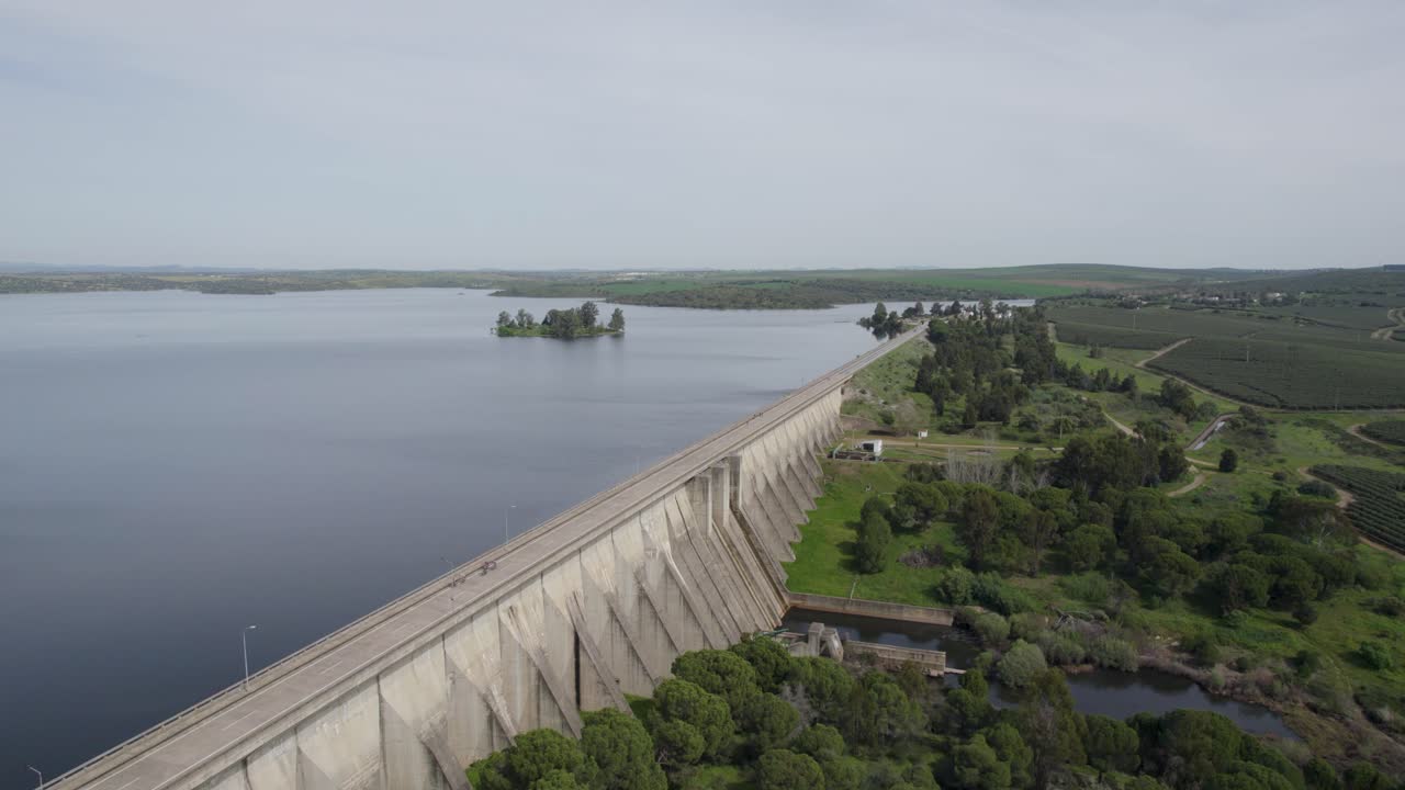 Drone along Caia Dam revealing reservoir waters and countryside, Portugal