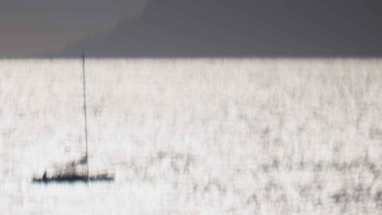 Blurred view of boats moving on the sea on a sunny day