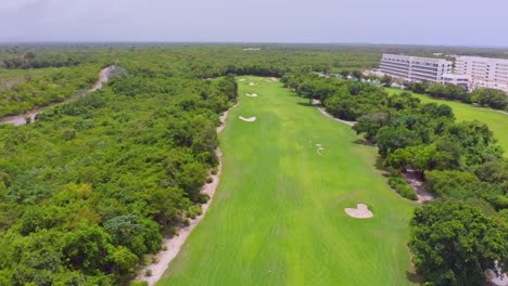 aerial flyover caribbean luxury cana rock club golf course fairway green, dominican republic