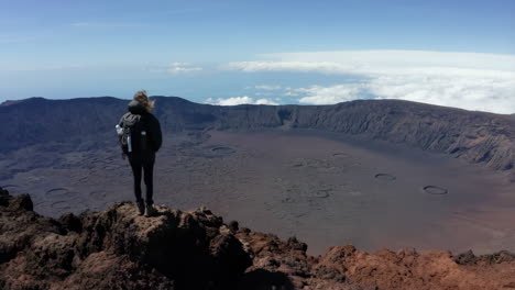 hiker on a volcano crater