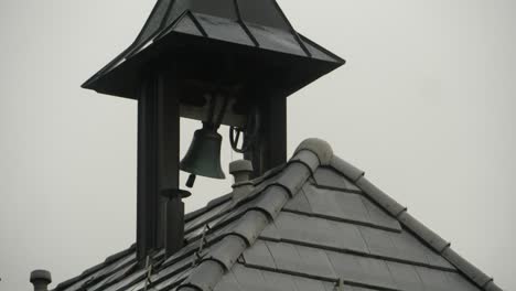 Small-Bell-in-Rooftop-Turret-Stops-Ringing-on-Gloomy-Day