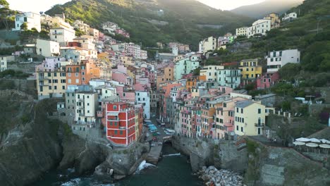 aerial pullback reveals incredible town of riomaggiore in cinque terre, italy