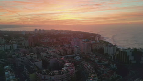 coastal town golden sky aerial view. amazing sunset horizon over resort city