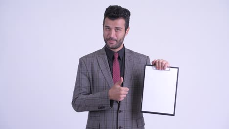 happy handsome bearded persian businessman in suit