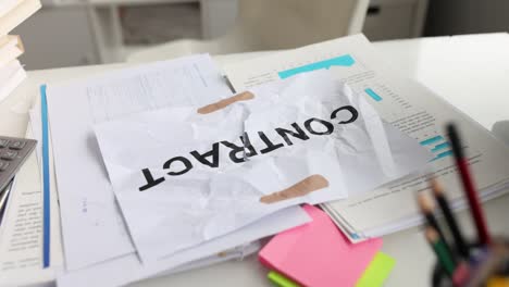 Inscription on crumpled document contract sealed with adhesive tape
