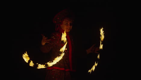 fire jugglers in traditional costumes