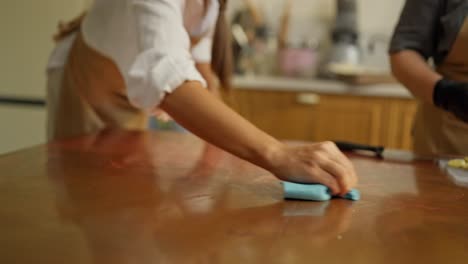 two women preparing food in the kitchen