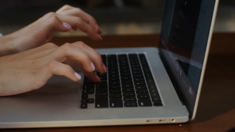 woman typing on laptop