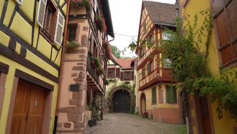 picturesque and beautiful street with half timbered houses in kayserberg village