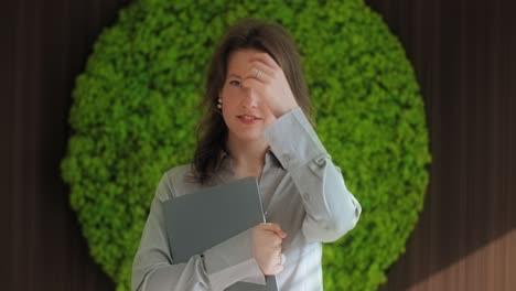 businesswoman with laptop in modern office