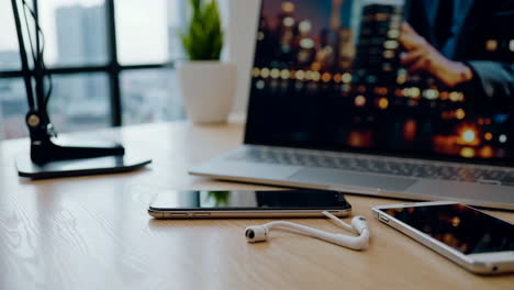 a modern workspace with technology devices on a wooden desk