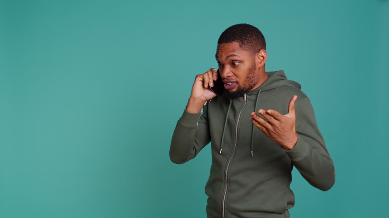Man enjoying talking with friends in phone call using smartphone