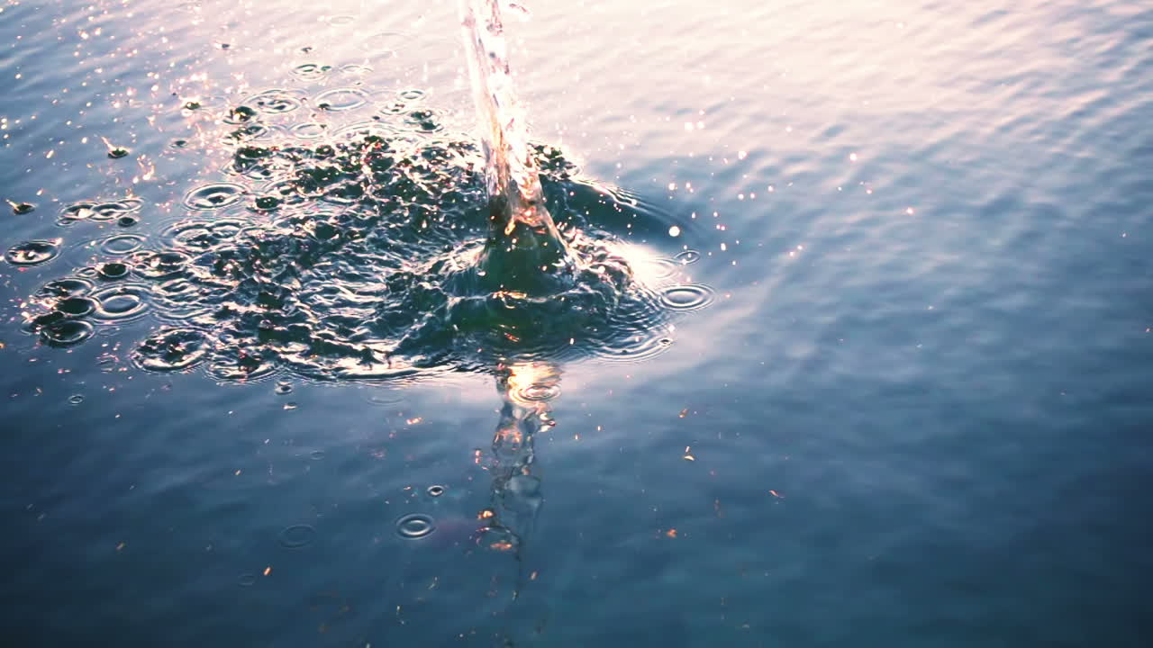 The stone falls in water. Slow Motion