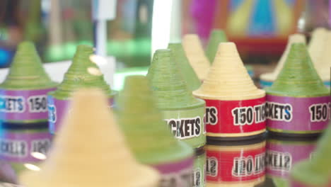 arcade games tickets bonus prize spinning on a mirror, closeup shot