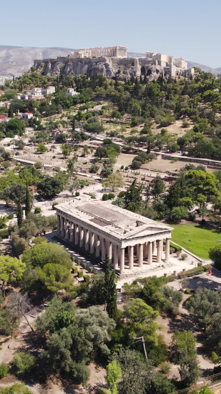 Temple of Hephaestus with Acropolis hill in Athens Greece vertical