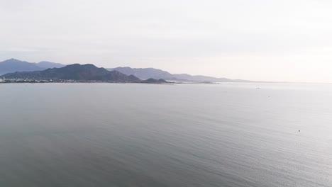 aerial view pan of the coast and the mountains in phan rang–tháp chàm.