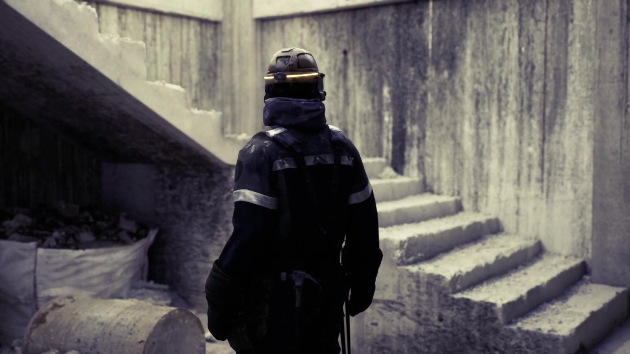 Emergency responder carefully navigates shadowed underground