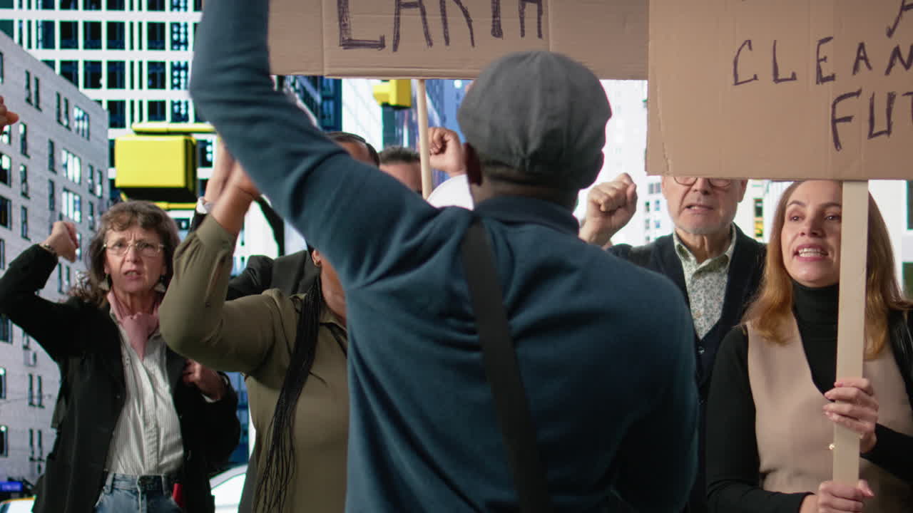 Protesters and demonstrators gather in a large environmental rally