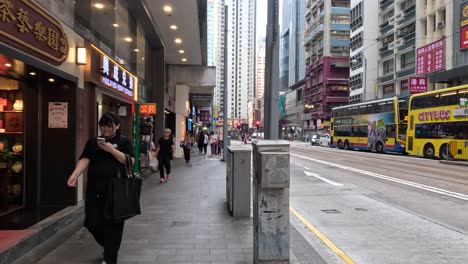 pedestrians walking along a bustling city street