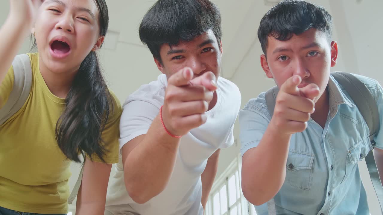 Asian Students At High School Bullying At The Camera