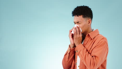 Tissue,-blue-background-and-blowing-nose