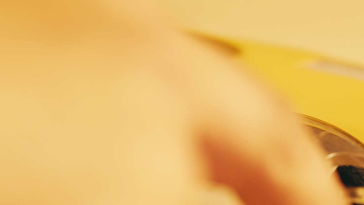 Vintage Yellow Rotary Phone Closeup