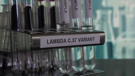 lambda c37 variant test tube samples being inserted into rack