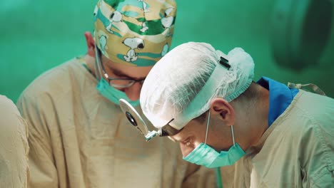Team surgeons at work in operating room. Surgeons team during operation process in surgery