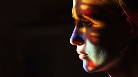 artistic portrait of a woman in dramatic lighting