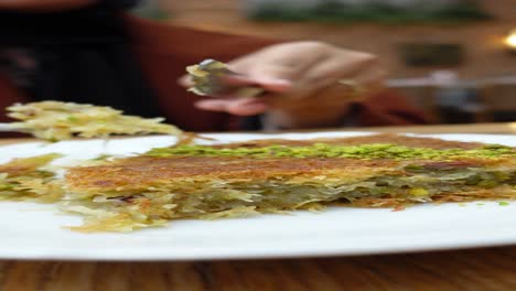 woman eating baklava