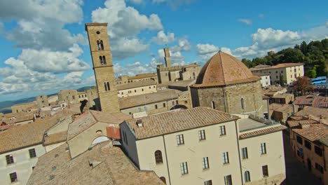 fast aerial over the walled town of volterra, province of pisa, italy