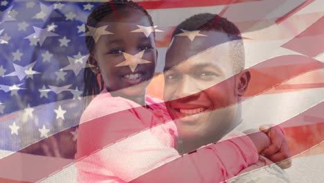 animation of american flag over smiling african american soldier father holding daughter