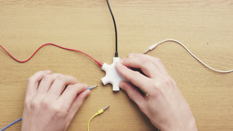 top view hands connecting data cables global sharing network concept desk from above - red epic dragon