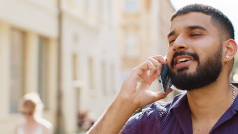 man talking on phone in the city