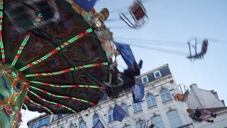 people flying in a christmas carousel from different perspectives at winter time