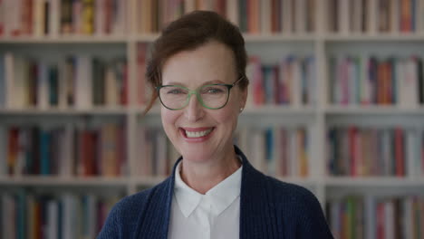 portrait successful senior business woman laughing enjoying career milestone elegant female entrepreneur wearing glasses in library bookshelf background