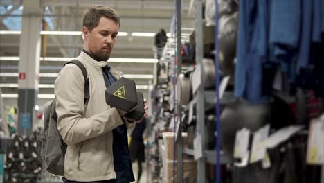 man shopping for fitness equipment in a sporting goods store