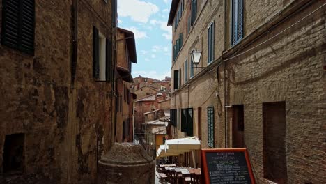 alley of siena one of a beautiful town in tuscany, italy during summer