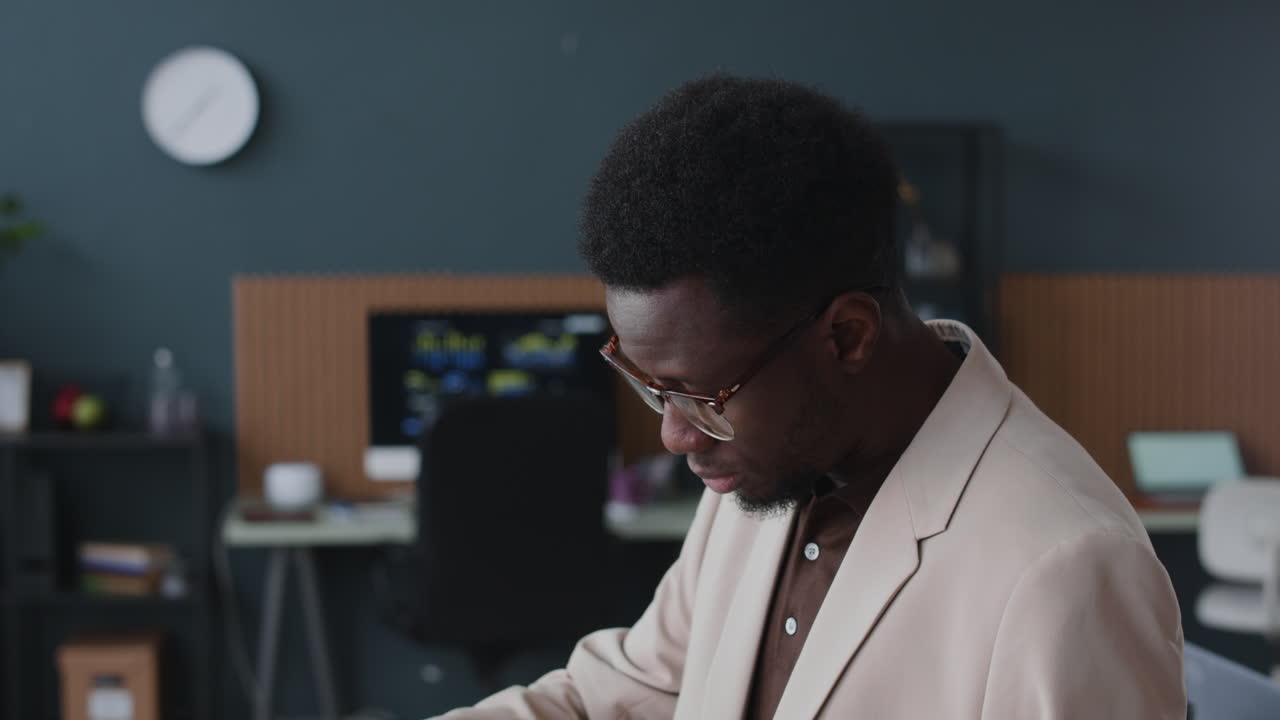 Businessman reviewing document in office
