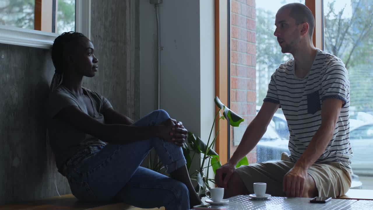 Couple interacting with each other in cafe 4k
